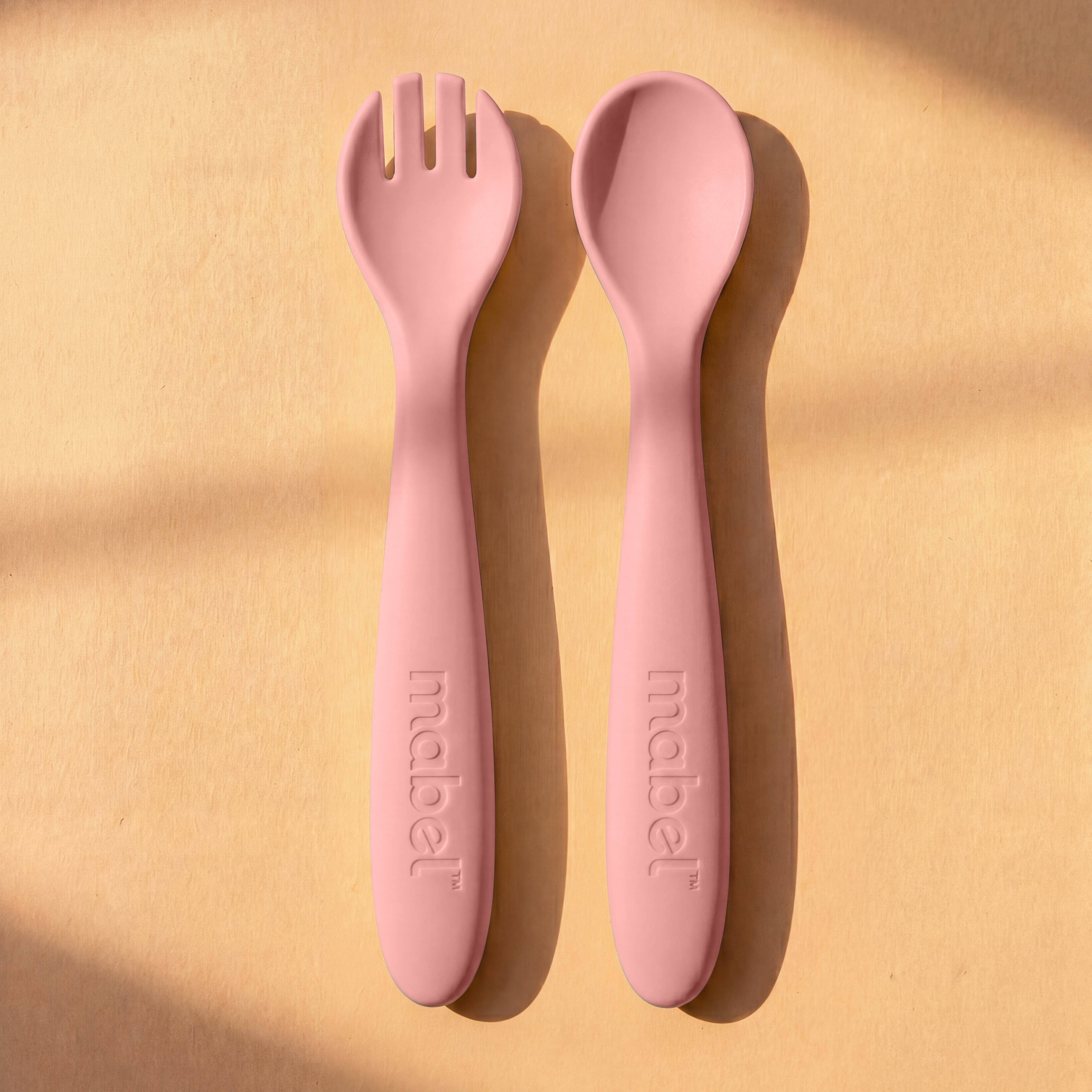 Mabel food-grade silicone spoon and fork in Fig Dusk Pink for baby-led weaning