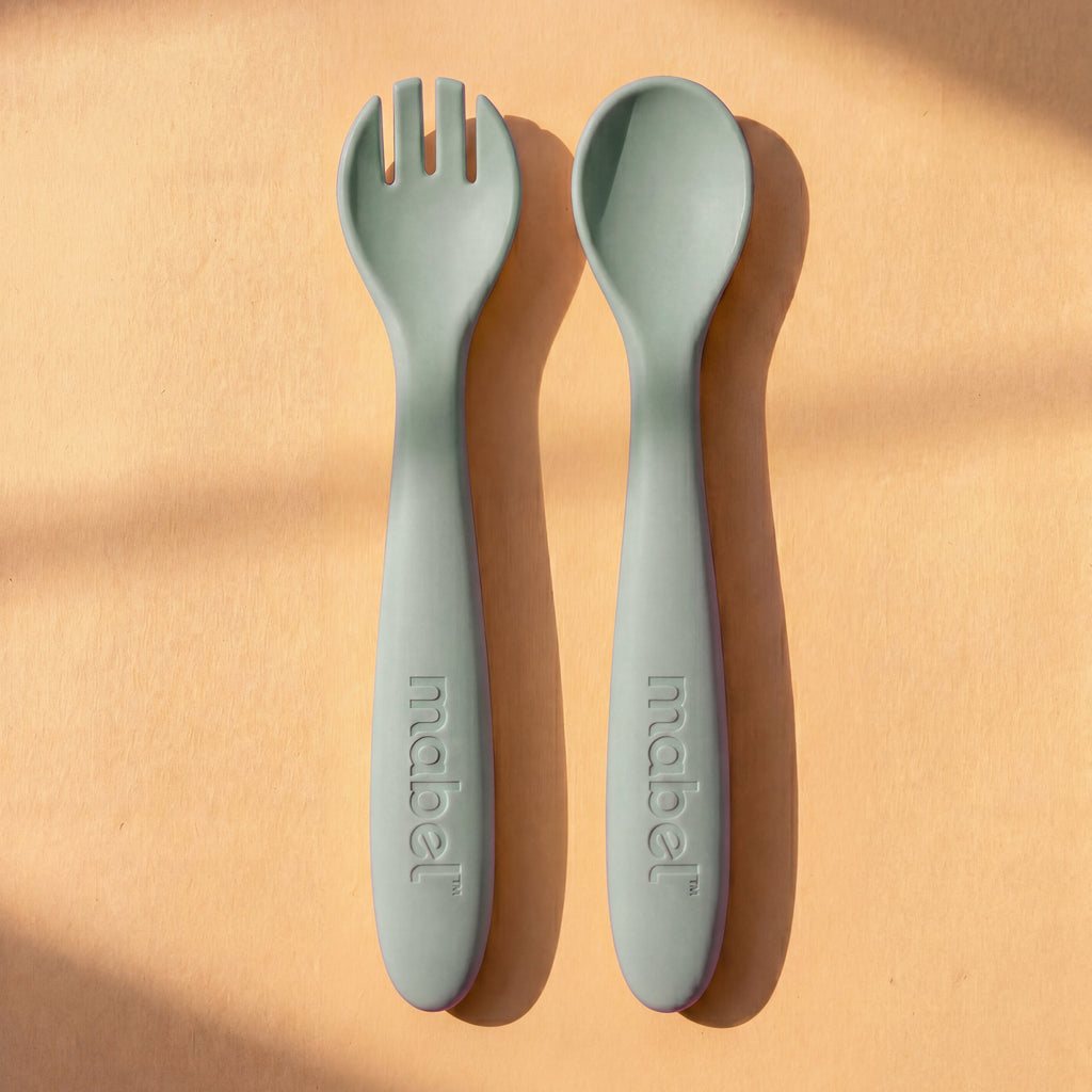 Mabel food-grade silicone spoon and fork in Pistachio Moody Blue for baby-led weaning
